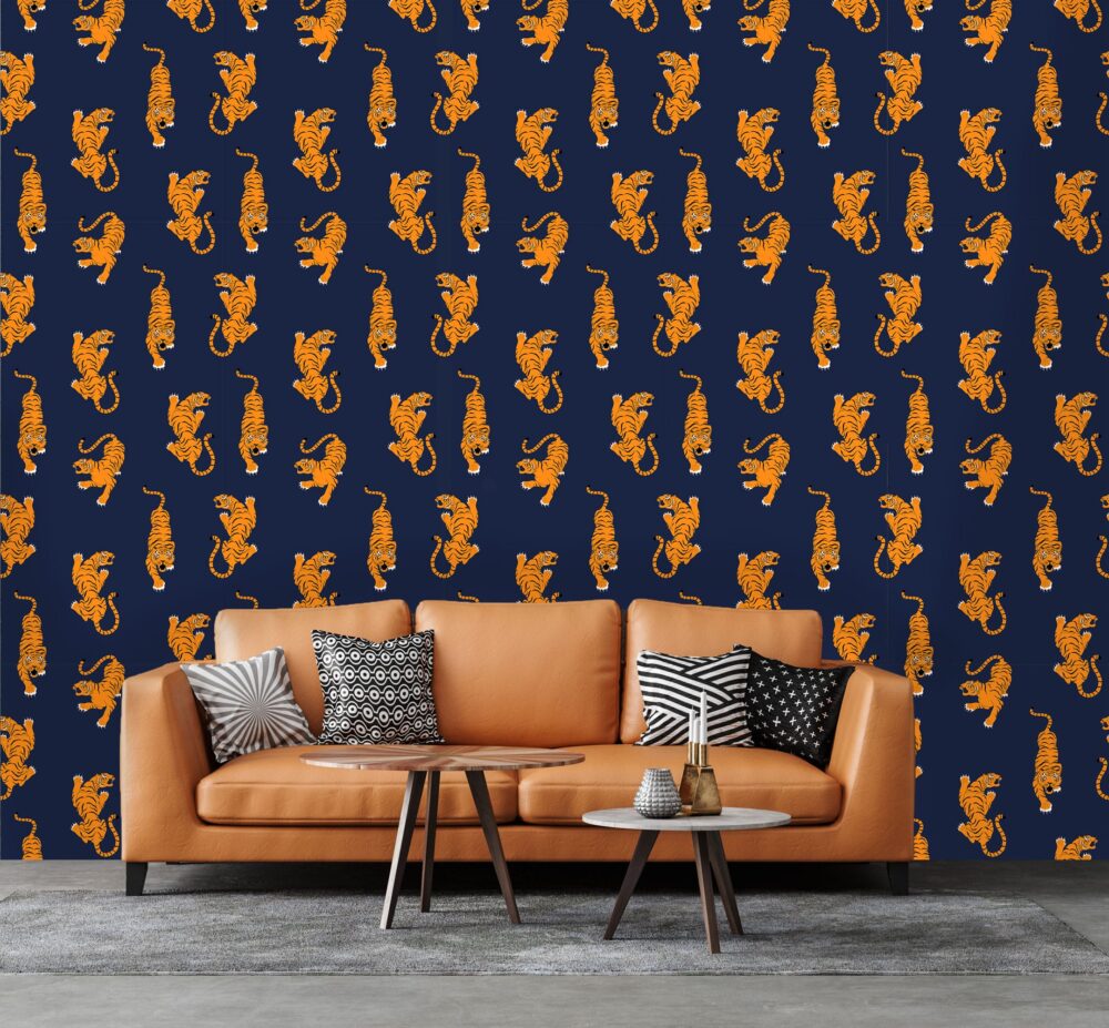 Peel and stick wallpaper of bright orange tigers on a navy blue background.