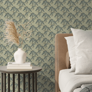 Westcott Bluebells peel and stick wallpaper with hand-drawn blue floral sprigs on a sage green background behind a cozy neutral bed