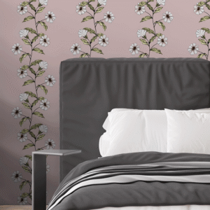Trailing Flowers Jaipur Pink wallpaper in a modern bedroom with grey bedding, black shelving, and vertical floral stripes on soft pink walls zoomed-in