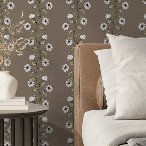 Trailing Flowers peel and stick wallpaper in sand dune beige with vertical white floral vines and green leaves behind a modern beige bed