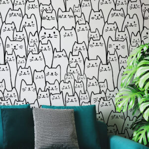 A zoomed-in playful black and white cat doodles repeating pattern wallpaper.
