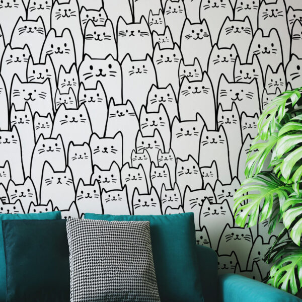A zoomed-in playful black and white cat doodles repeating pattern wallpaper.