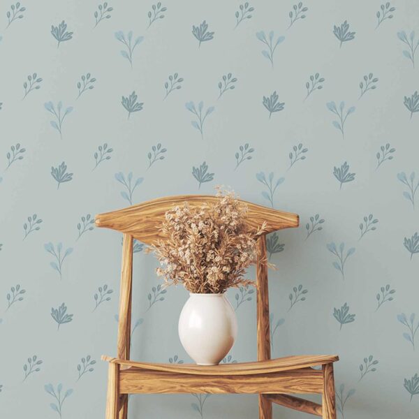 A zoomed-in minimalist wooden chair against light blue floral wall covering