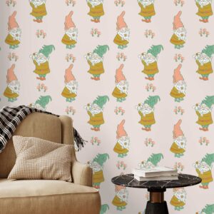 A zoomed-in whimsical gnome-themed wallpaper in a cozy reading nook with a beige armchair, black side table, and soft drapes