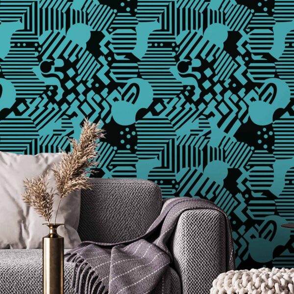 Here for a Good Time peel and stick wallpaper with bold black and cyan abstract shapes behind a modern grey sofa and textured throw