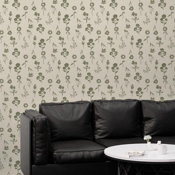 Zoomed-in Oxford Court Floral Wallpaper behind indoor plants and stone wall in a natural light-filled room