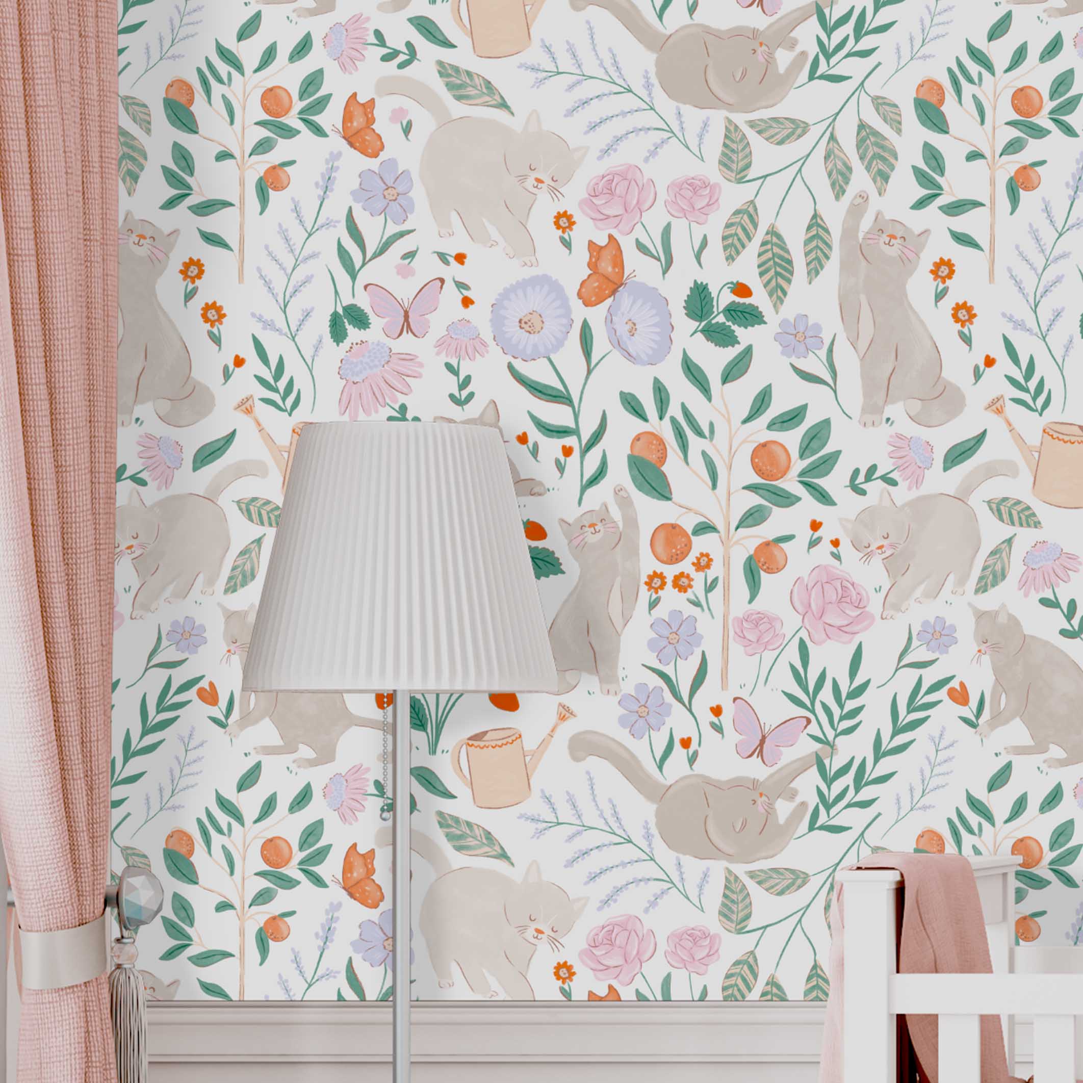 Purrfect Garden Wallpaper | Peel & Stick Wallpaper Online | Proudly Made in Canada A zoomed-in Purrfect Garden wallpaper showing whimsical cats among pastel flowers and greenery, styled with blush curtains, a white crib, and soft bedding