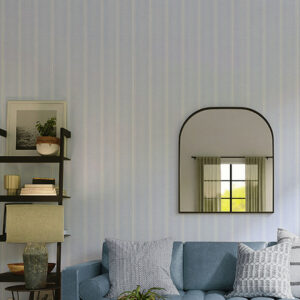 This is a zoomed-in vertical striped wallpaper in soft blue tones behind modern blue sectional sofa