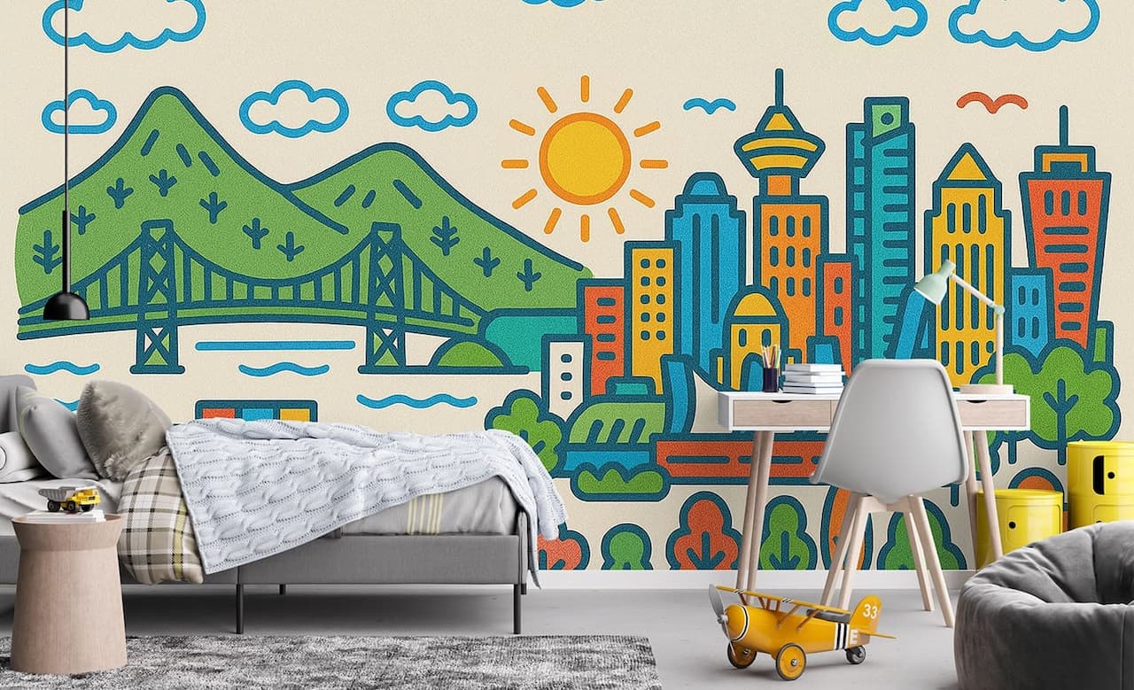Colorful cartoon mural of Vancouver skyline with mountains, bridge, and sun, decorating a modern bedroom and desk setup for a playful city-themed interior.