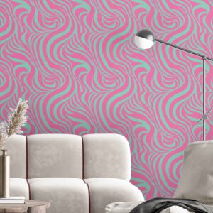 A stick wallpaper in pink and mint wavy abstract lines behind a cream velvet sectional in a modern living room