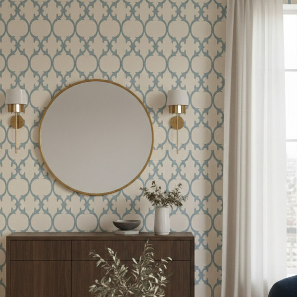 A close-up of chambray blue ogee trellis wallpaper showing fabric-like texture and soft woven finish