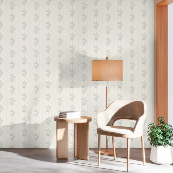 Lintea Wallpaper in sage green floral stripes featured in a minimalist sitting area with a wooden chair and soft daylight