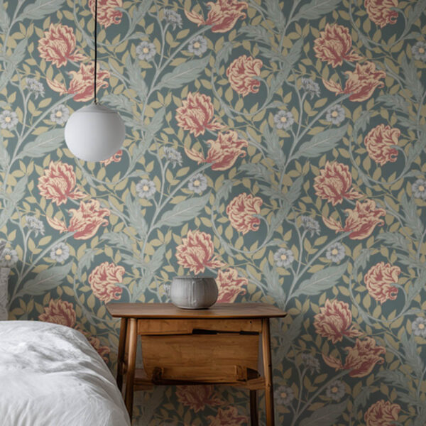A zoomed in prairie inspired carnation floral wallpaper on a wall