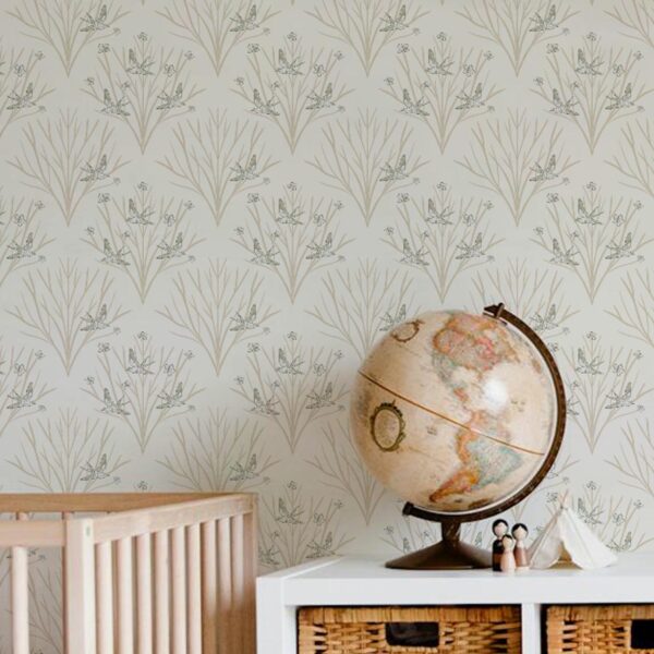 A zoomed-in heirloom Songbirds Wallpaper in a cozy child’s room with wicker storage and globe