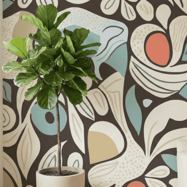 A zoomed-in of abstract botanical mural with curved leaves and retro color accents styled beside a potted fiddle leaf fig.