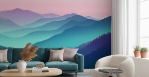 A zoom in of a layered mountain mural in teal and blue hues behind a sofa with neutral cushions and natural decor.