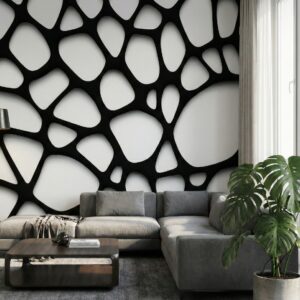 A zoomed-in of an organic black and white cellular pattern mural wrapping a contemporary living room with soft light and lush green plant.