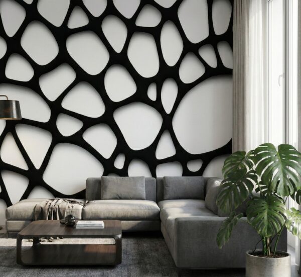 A zoomed-in of an organic black and white cellular pattern mural wrapping a contemporary living room with soft light and lush green plant.