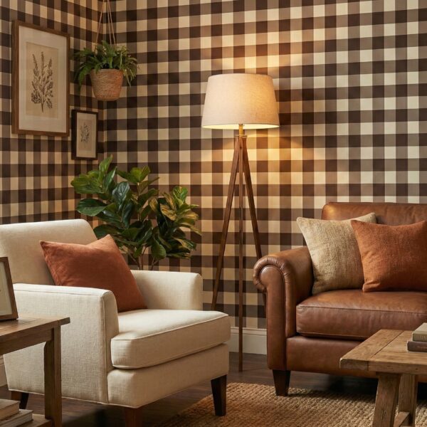 A zoomed-in of chocolate gingham wallpaper in a living room with leather sofa, accent chairs, wooden furniture, and warm neutral decor.