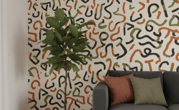 A zoomed-in of an abstract squiggle wallpaper with organic black, green, and terracotta lines paired with neutral seating and indoor plants.