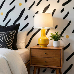 zoomed-in of a lively abstract wallpaper with sweeping black lines on a soft white base