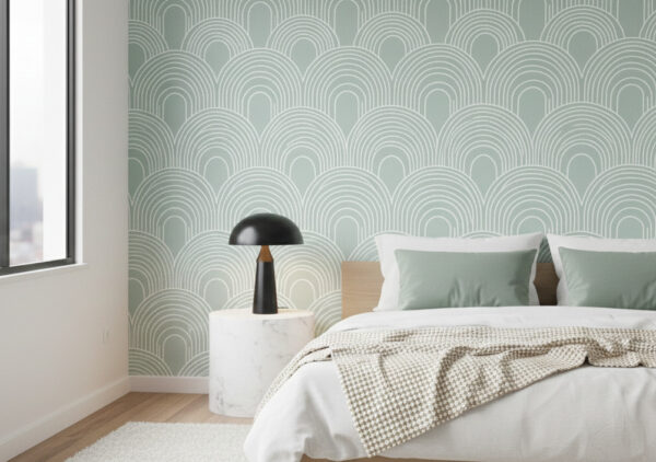 A zoomed-in of sage green arches wallpaper featuring repeating curved line motifs in soft green and white.