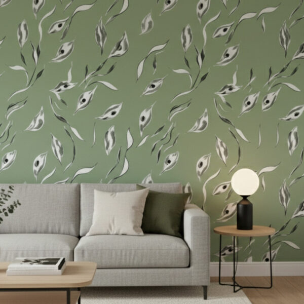 A zoomed-in of a sage green foliage wall mural, light sofa, neutral decor, and soft natural textures