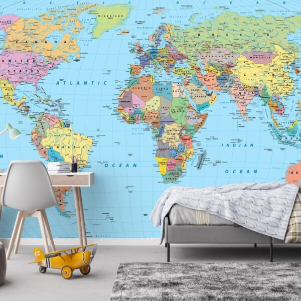 World map wallpaper mural in a kids bedroom with desk and bed