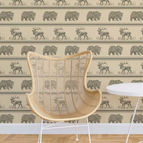 Fur & Hide wallpaper styled with a woven chair and table featuring horizontal rows of bears and deer on a warm beige background