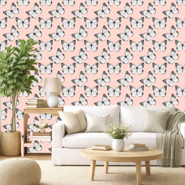 Butterfly Breeze wallpaper zoomed-in with black and white butterflies on a soft blush pink background.