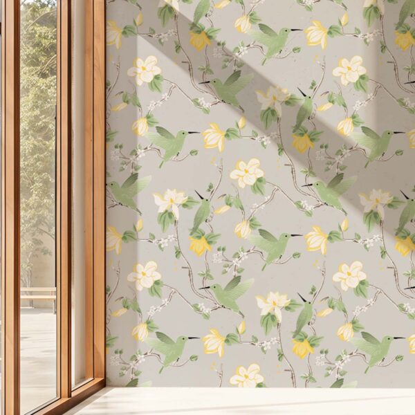 Garden Sage chinoiserie wallpaper featuring birds and blooming branches with natural light casting shadows across the wall