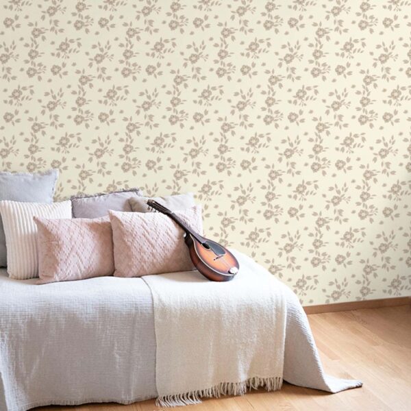 Flowery Hardwick White wallpaper in a soft bedroom setting with beige floral pattern on a warm white background
