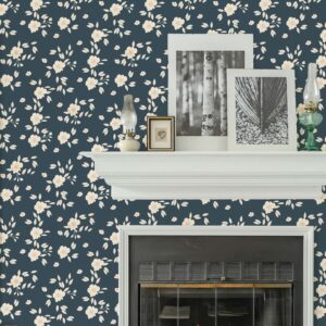 Hazel Wallpaper in Midnight Bloom with soft cream floral pattern on deep blue wall behind a fireplace mantel