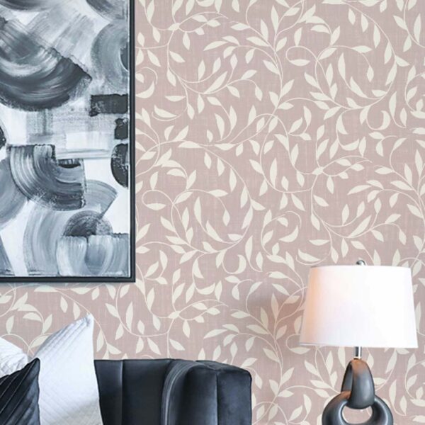 Oxford Court Ivy wallpaper in Petal Clay styled with a blush pink vine pattern behind a dark accent chair and modern artwork