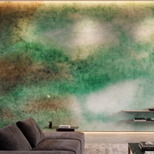 A zoomed-in of Emerald Drift Mural showcasing layered emerald and moss-toned watercolor textures behind a contemporary sofa.