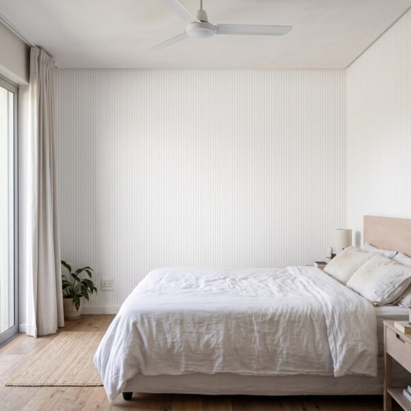 Subtle Stripes Wallpaper shown in a bedroom